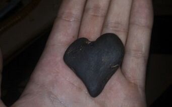 a heart-shaped stone as a talisman of happiness