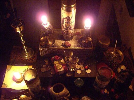 an amulet of lighted candles and coins for good luck