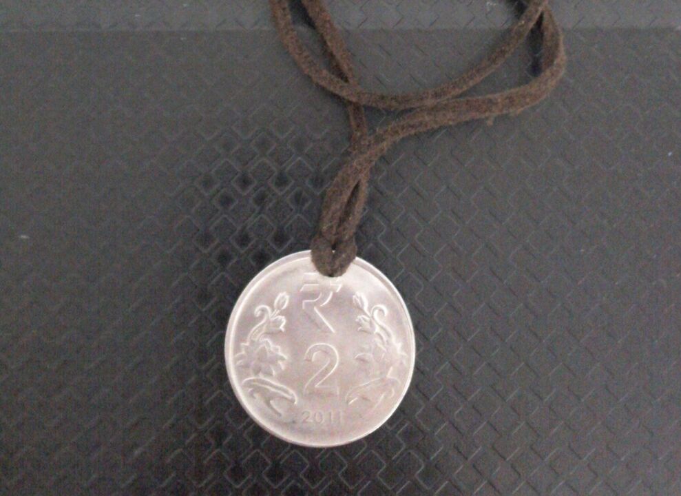 coin amulet to attract wealth